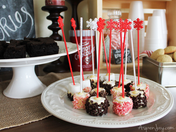 Marshmallow stir sticks- so clever! Love the snowflake on top.Rustic Hot Chocolate Bar at a Caroling Party. So Fun! I need to plan one next year!