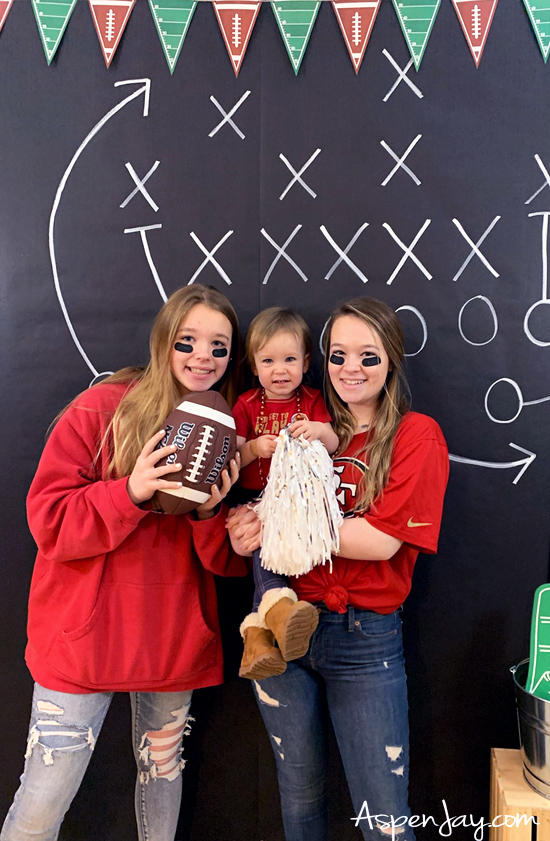 DIY Football Photo Backdrop! Great addition to any sports themed party! And so easy and cheap to make! #footballbabyshower #footballparty #footballparty #footballphoto