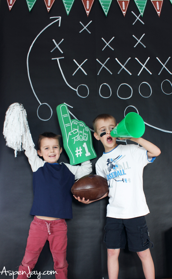 DIY Football Photo Backdrop! Great addition to any sports themed party! And so easy and cheap to make! #footballbabyshower #footballparty #footballparty #footballphoto