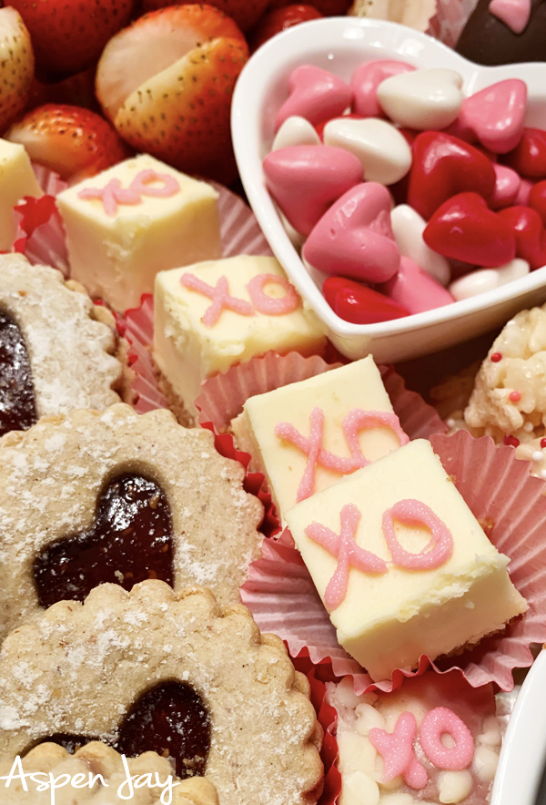 Impress your party guests by designing a Valentines Charcuterie Board for February the 14th. These tips will help you confidently make your own. #valentinescharcuterieboard #valentinesdessertboard