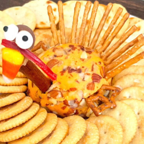 Impress your family and friends this Thanksgiving with this adorable turkey cheese ball recipe that even the kids can help make! #turkeycheeseball