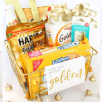 A gold themed basket of goodies and gifts is a fabulous golden birthday gift idea! It's simple to put together, can be scaled up or down to fit any budget, and is easily personalized to make for a perfect gift! Free Printables included! #goldenbirthday #goldengiftbasket #goldengift