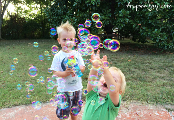 Looking to plan an EPIC summer? Create a summer bucket list - free printable included plus 99+ ideas to add to your list! Playing with bubbles is a must!