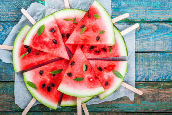 Looking to plan an EPIC summer? Create a summer bucket list - free printable included plus 99+ ideas to add to your list! Eating watermelon is a summer staple!