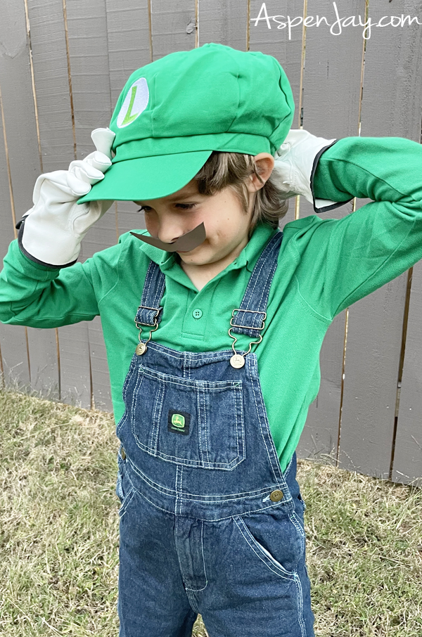 Need a fun and easy family costume theme for Halloween? Level up with these DIY Super Mario Family Costumes! Luigi's costume is so easy to replicate!