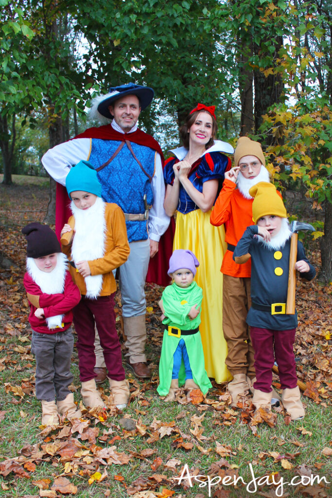 Family dressed as Snow White and the Seven Dwarfs in DIY Halloween costumes
