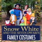 Family dressed as Snow White and the Seven Dwarfs in DIY Halloween costumes