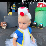 Need a last-minute Halloween idea? This DIY Toad costume for girls is simple, fun, and adorable! Follow this easy tutorial to make the hat, vest, and tutu so your toddler can be the cutest Toad in the Mushroom Kingdom. Save it to your ideas board today!