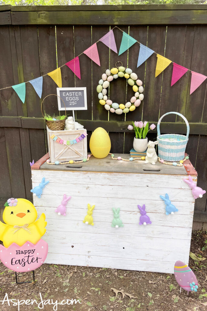 backyard Easter photo booth setup with decorations and pastel Easter decor