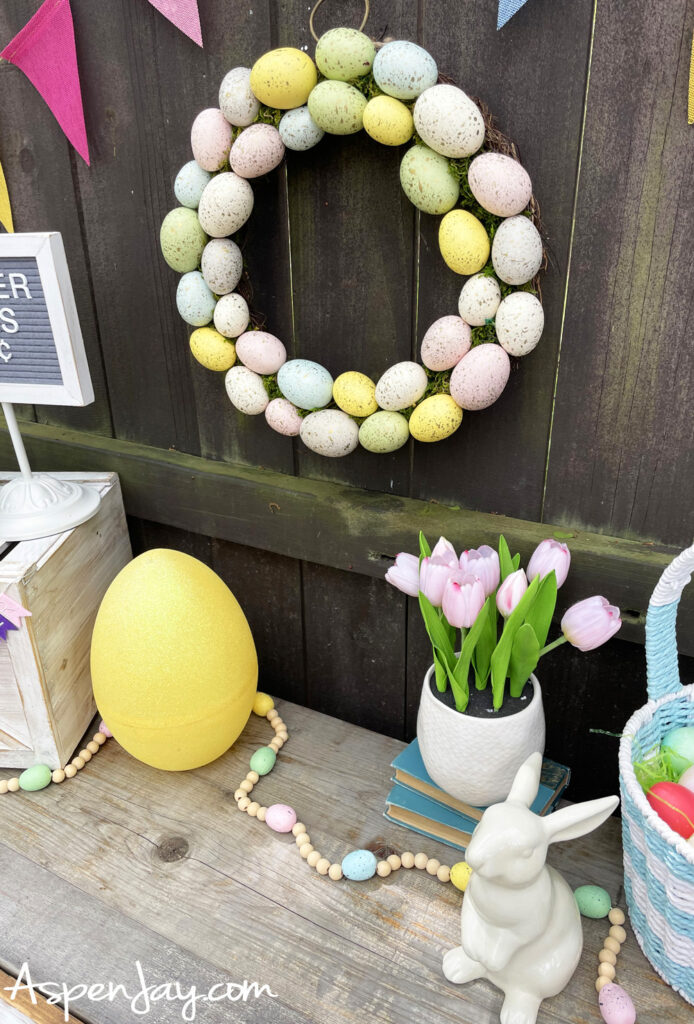 Easter party decorations with pastel egg wreath, bunny decor, and spring table styling