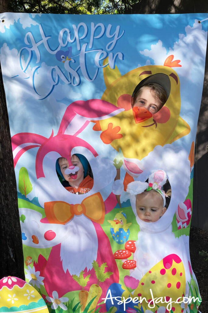 kids using Easter face cutout board for fun photo booth pictures