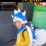 Child dressed in an epic handmade Koopa General Halloween costume outdoors